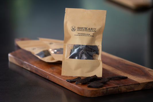 Shukaku brand package on a wooden cutting board with dried seaweed.
